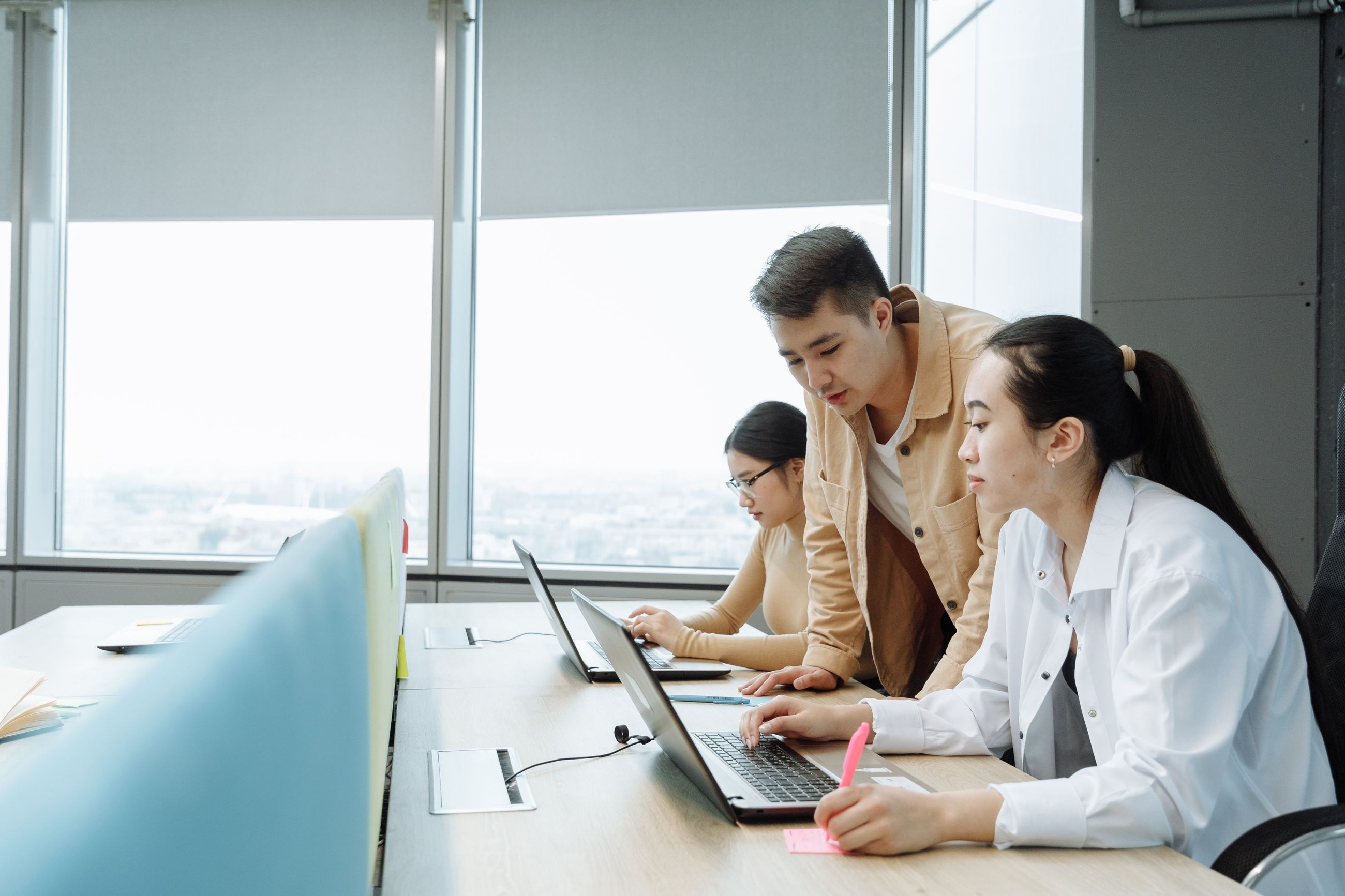 Atlas team members working together at their desks